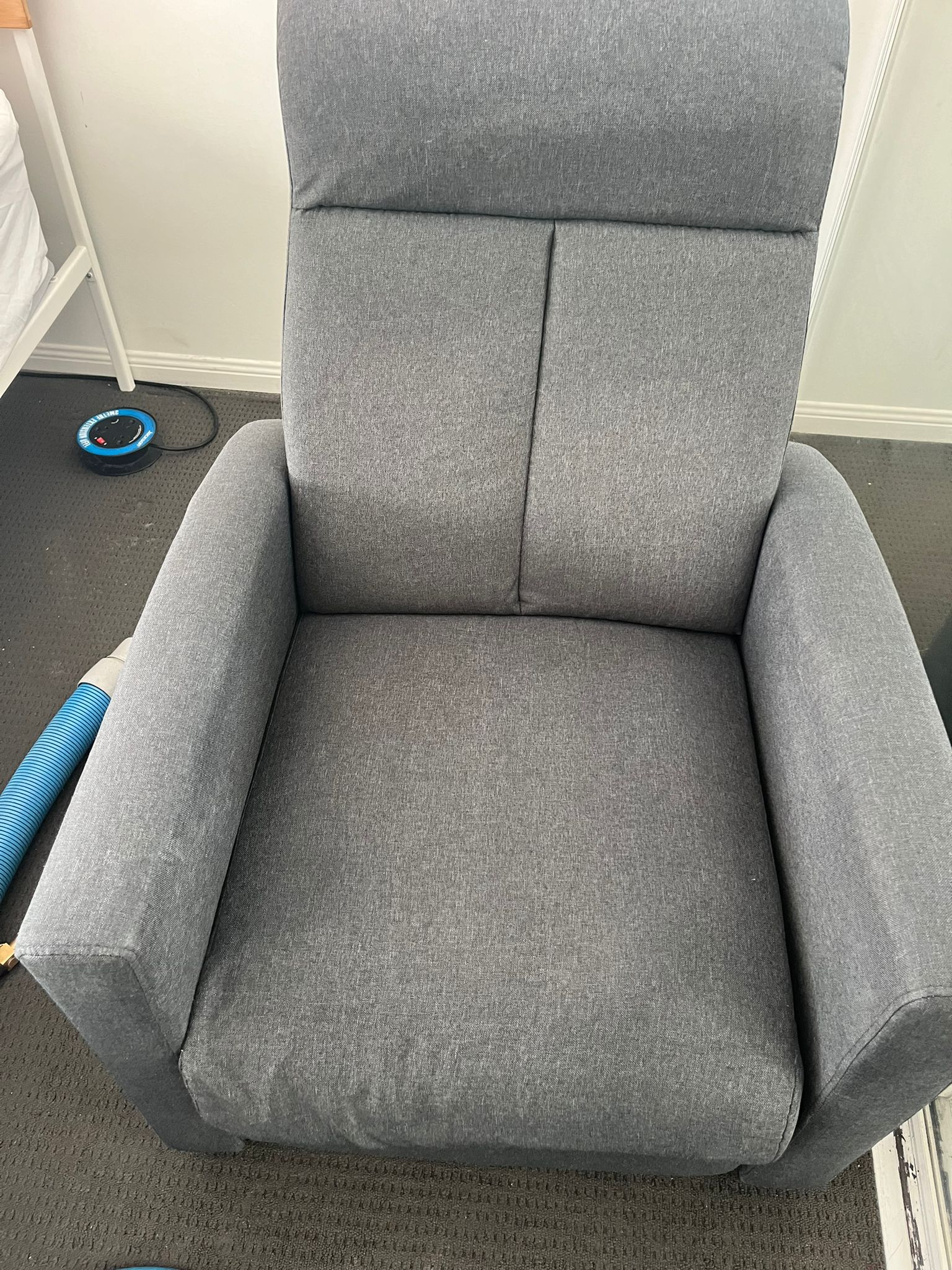 Clean fabric armchair after professional upholstery cleaning