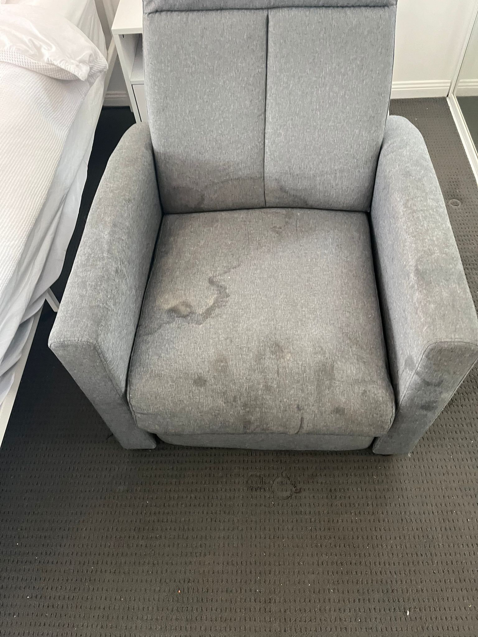 Lounge chair upholstery requiring professional cleaning